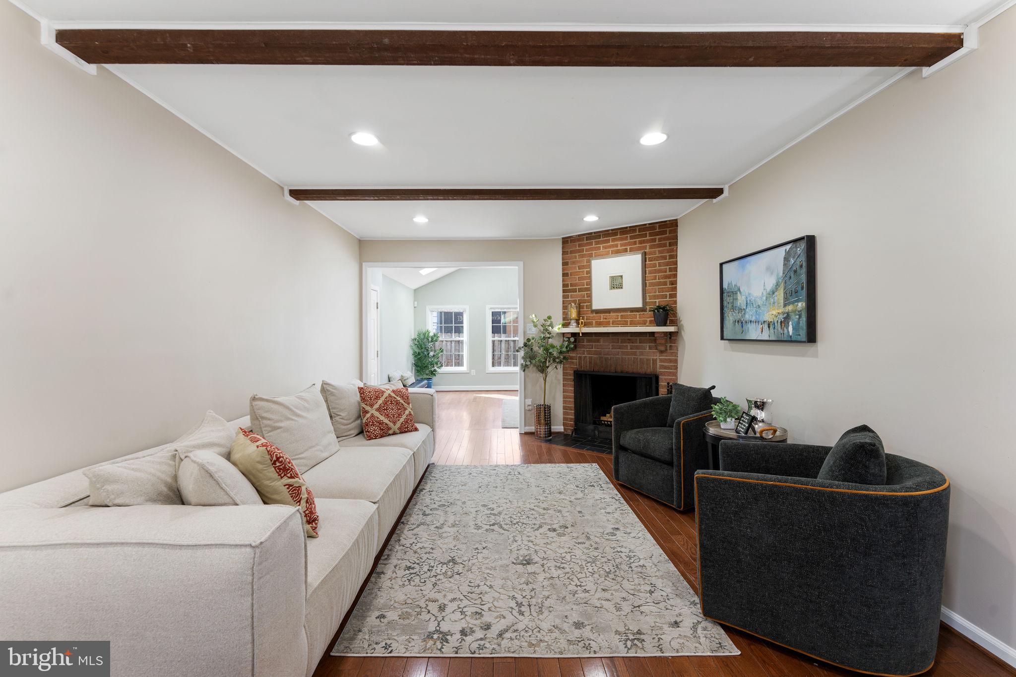 6140 Ramshorn Drive McLean, VA 22101 - Photo 10 of 72 a living room with furniture and a fireplace