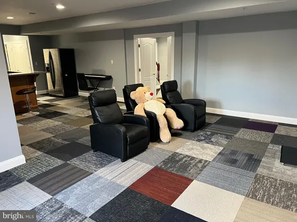 a living room with furniture and a rug