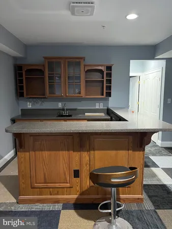 a kitchen with a sink and a stove