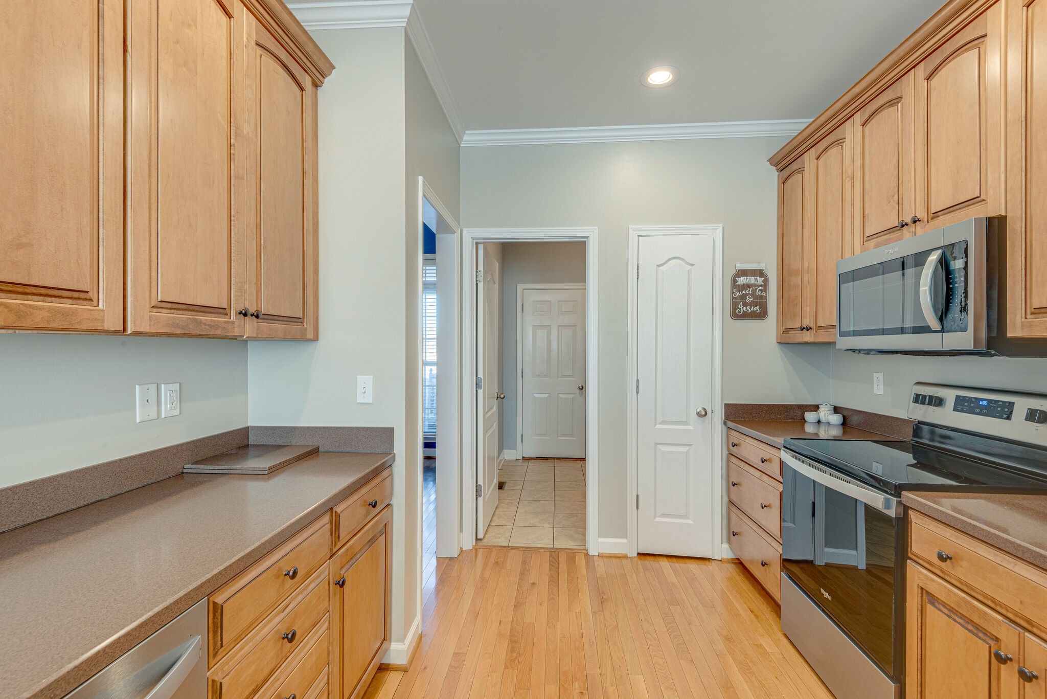 1686 Porter Road Bon Aqua, TN 37025 - Photo 11 of 28 a kitchen with granite countertop a stove a sink and a refrigerator