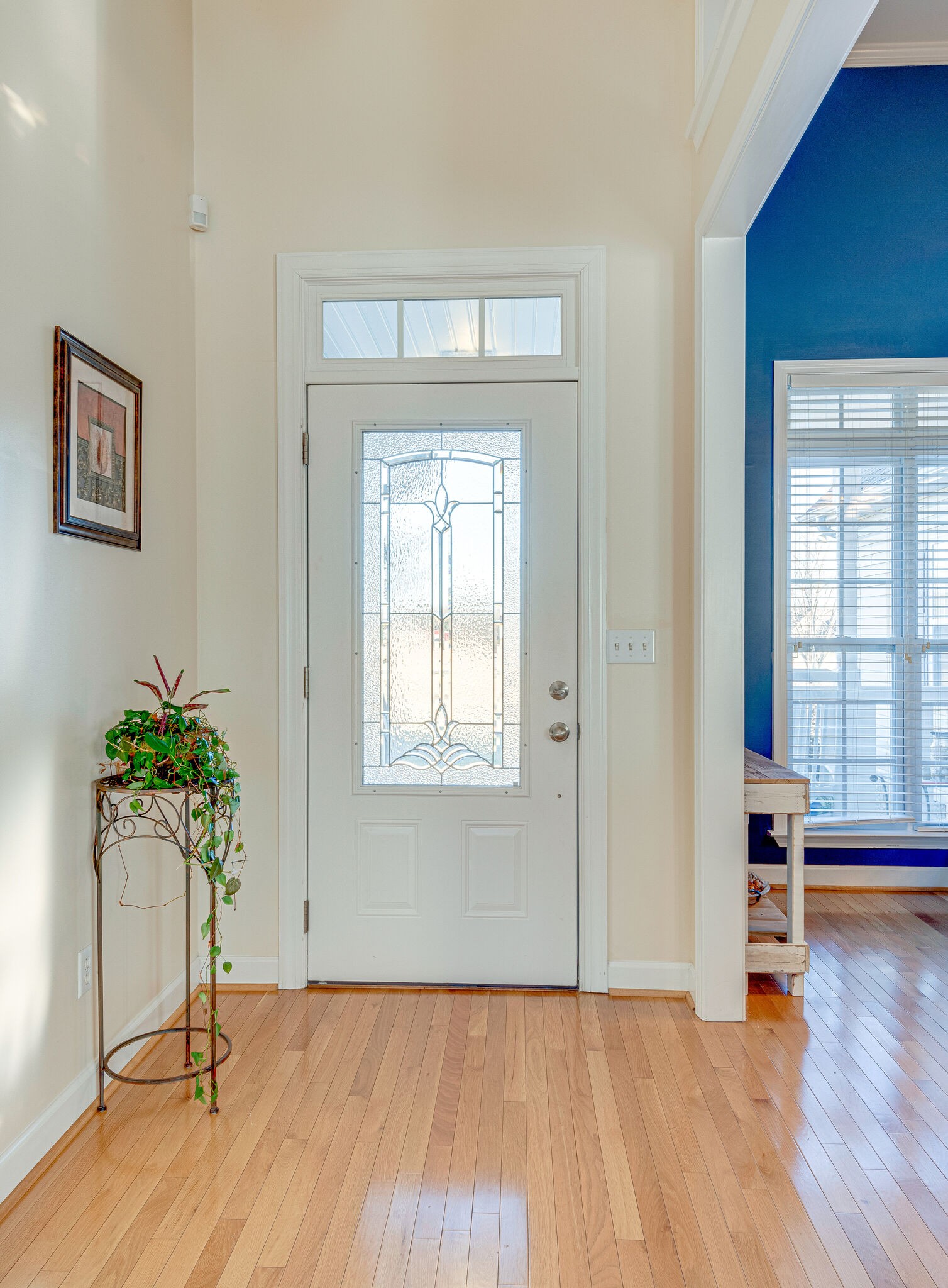 1686 Porter Road Bon Aqua, TN 37025 - Photo 4 of 28 a view of an empty room with a window and wooden floor