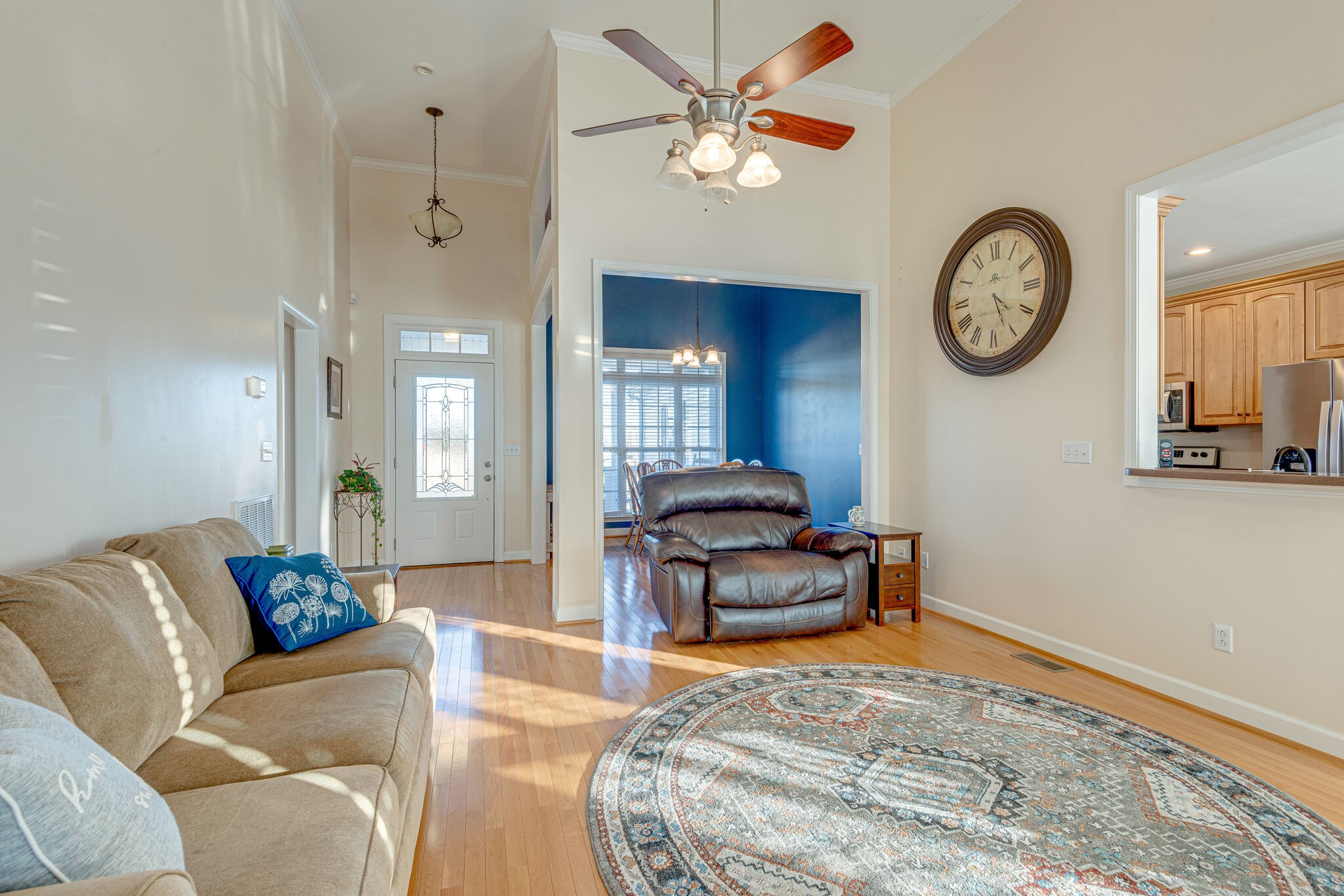 1686 Porter Road Bon Aqua, TN 37025 - Photo 6 of 28 a living room with furniture a clock and a wall painting