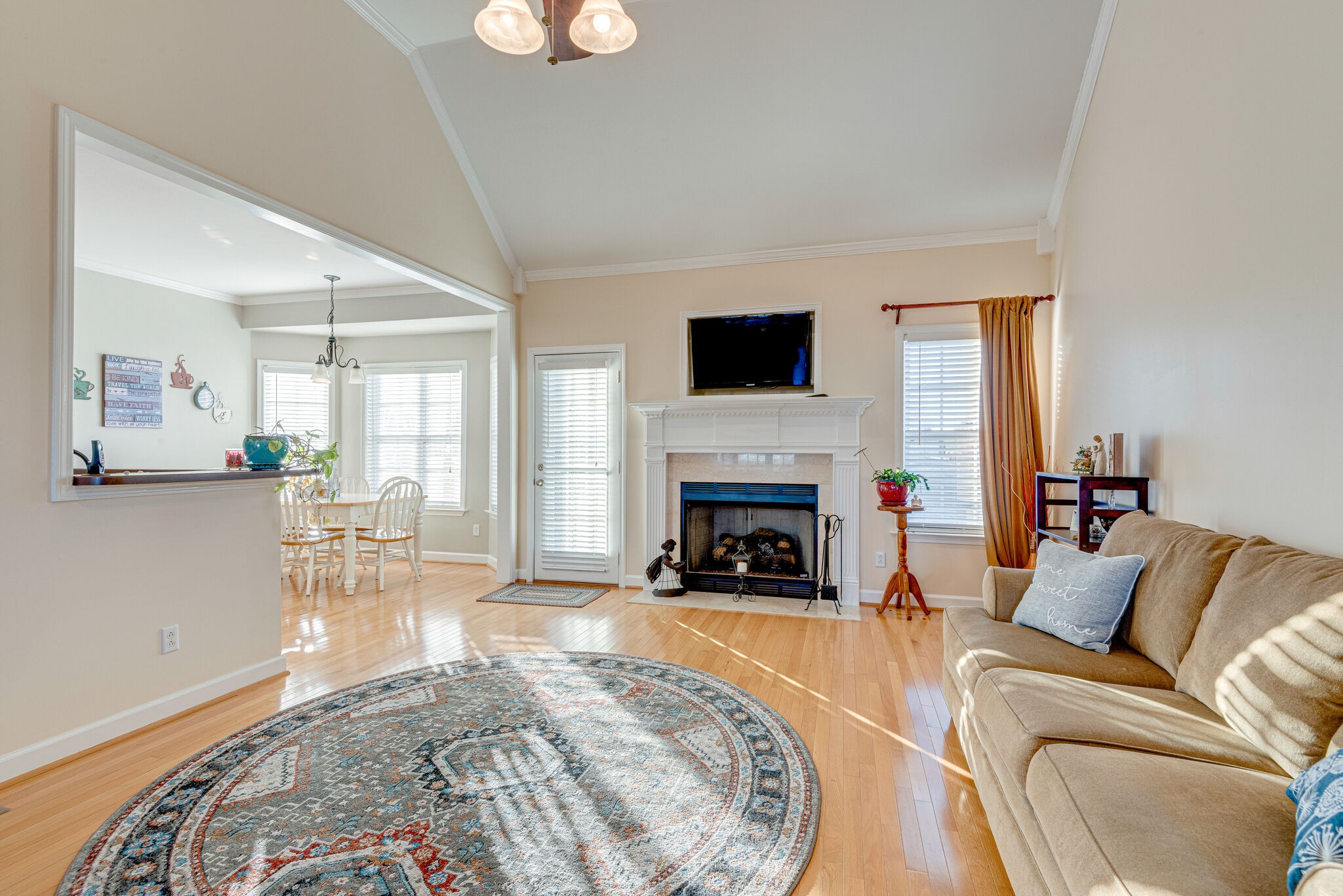 1686 Porter Road Bon Aqua, TN 37025 - Photo 7 of 28 a living room with furniture a fireplace and a flat screen tv