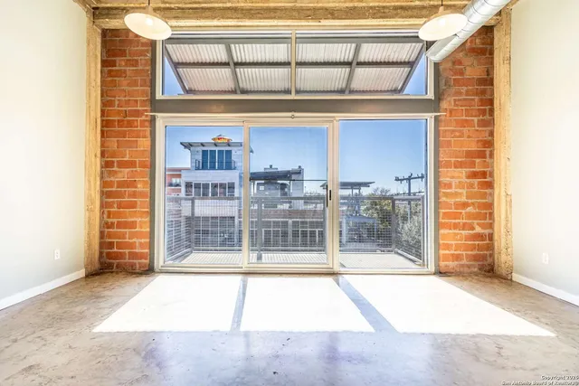 a view of a brick house with a large window