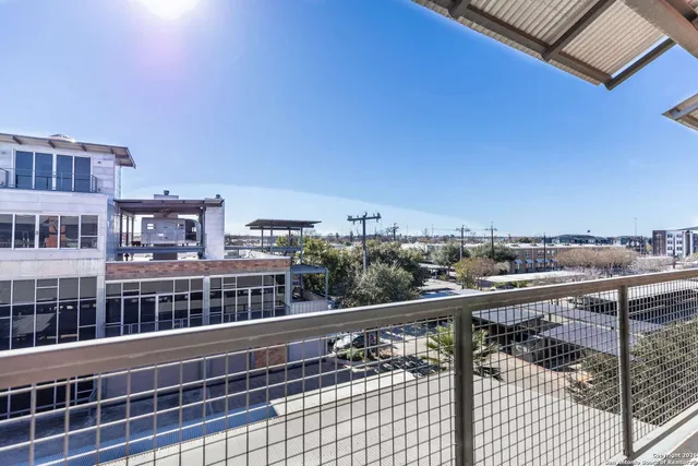 a view of a balcony with city view
