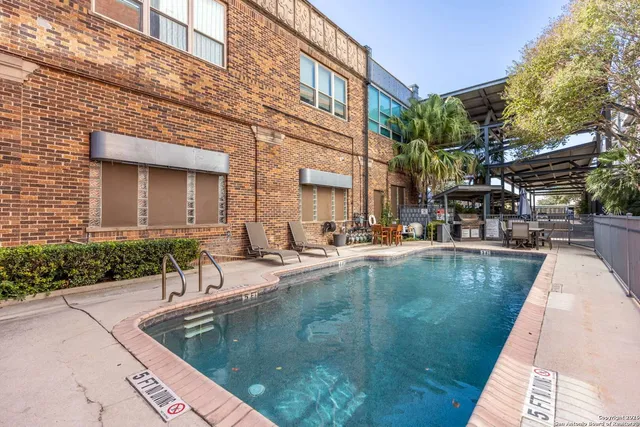 a view of a swimming pool with a patio