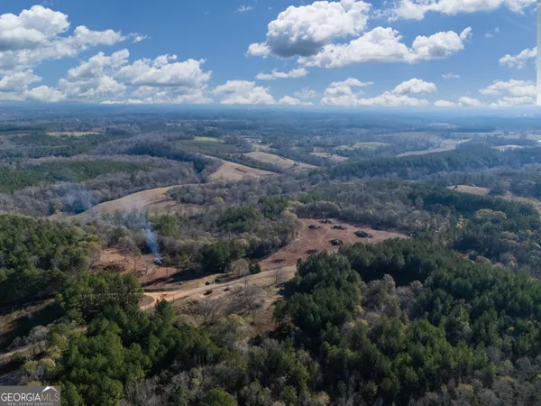 an aerial view of red and white house