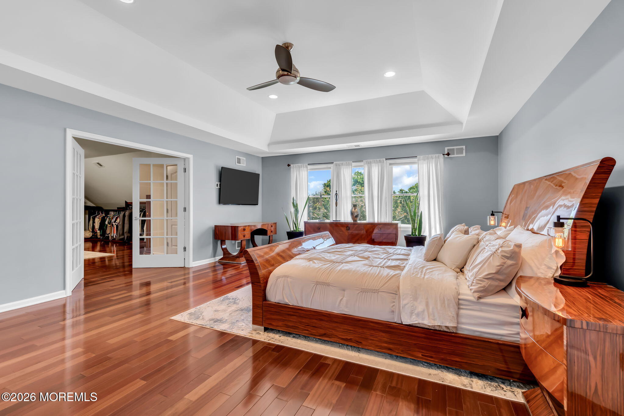 14 Diamond Hill Road Marlboro, NJ 07746 - Photo 38 of 79 a bedroom with a bed and a chandelier