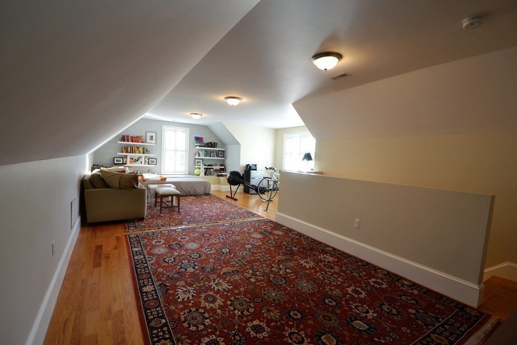11 Tufts Road, Unit 11 Winchester, MA 01890 - Photo 13 of 18 a living room with furniture and a rug