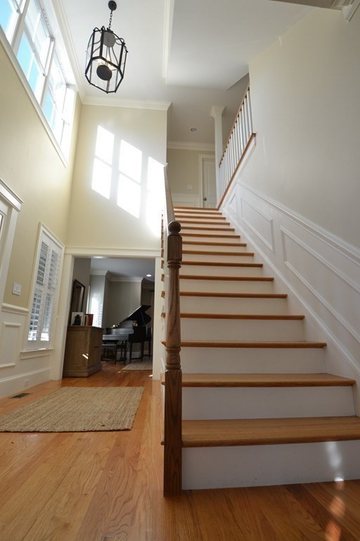 11 Tufts Road, Unit 11 Winchester, MA 01890 - Photo 14 of 18 a view of entryway and hall with wooden floor