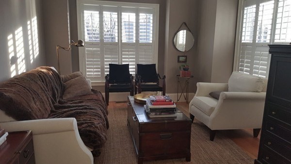 11 Tufts Road, Unit 11 Winchester, MA 01890 - Photo 6 of 18 a living room with furniture a large window and wooden floor
