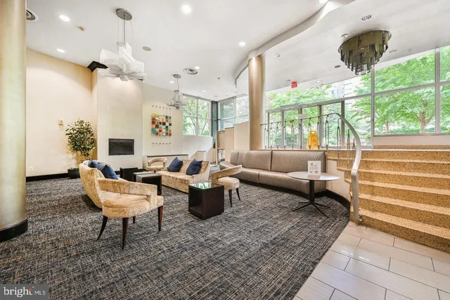 a living room with furniture and a large window