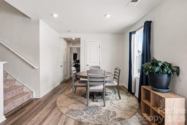 a living room with furniture potted plant and a potted plant