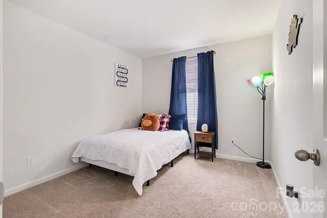 a bedroom with a bed and a table