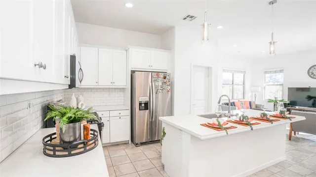 a dining room with furniture and potted plant