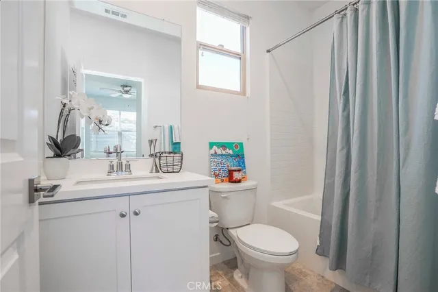a bathroom with a sink toilet and a mirror
