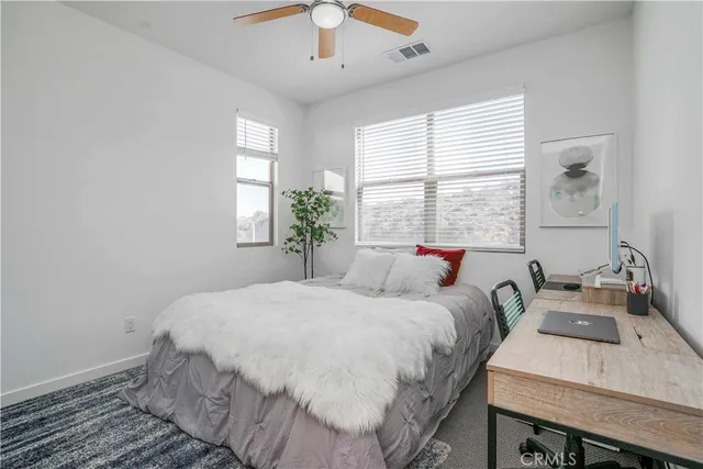 a bedroom with a bed and a table