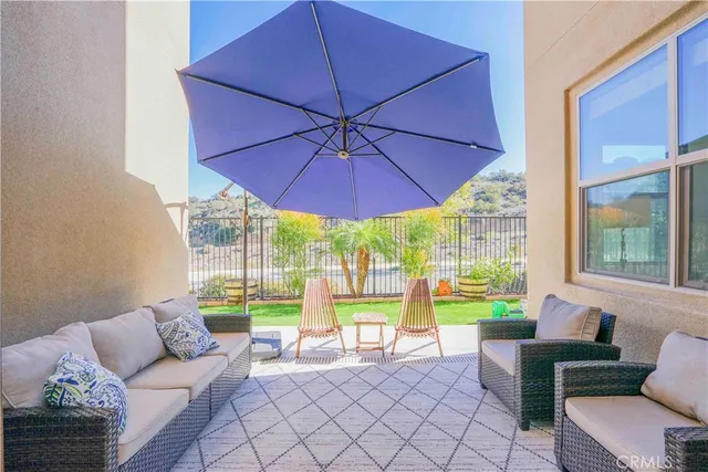 a living room with furniture and a garden