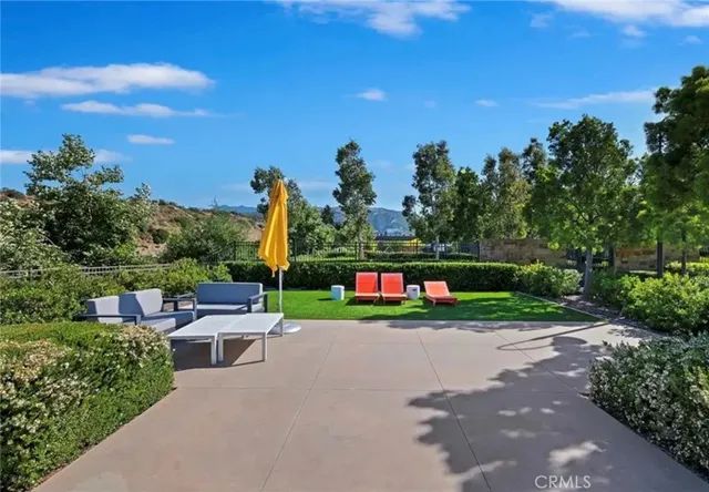 a view of park with plants and outdoor seating