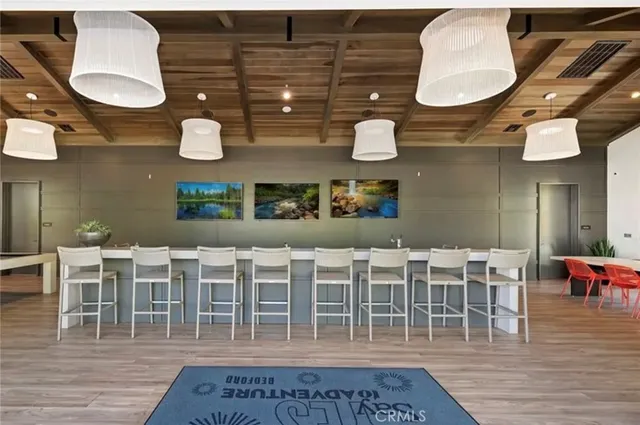 a dining room with chairs and wooden floor