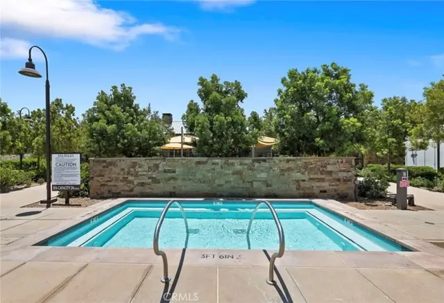 a view of a swimming pool with a patio