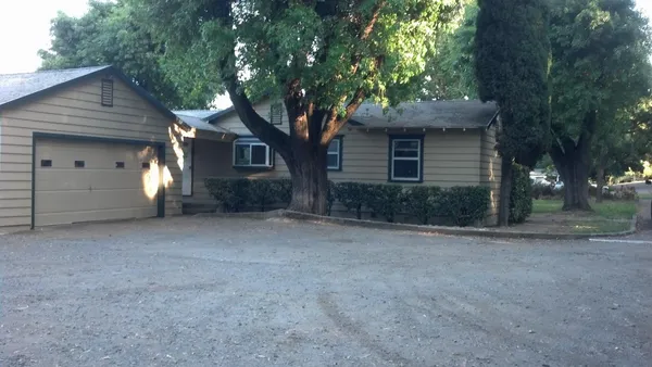 a view of a house with a yard