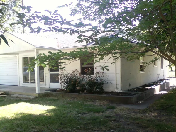 a house view with a garden space