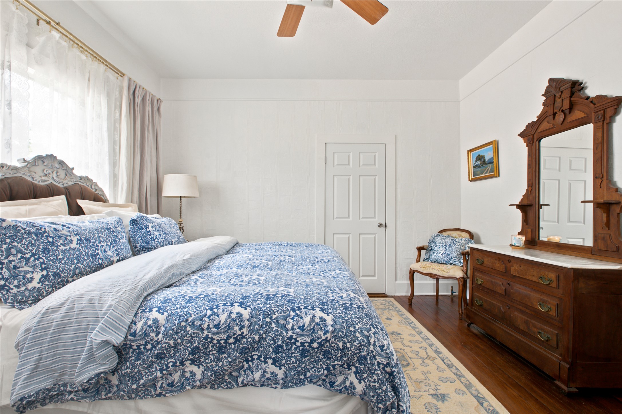 372 Old Lockhart Road Lockhart, TX 78644 - Photo 20 of 40 Elegant hardwood flooring enhances this bedroom's graceful character.