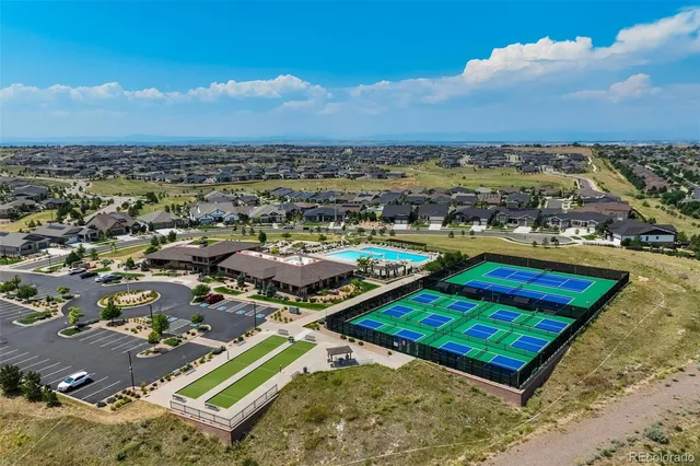 an aerial view of a pool patio swimming pool and outdoor seating
