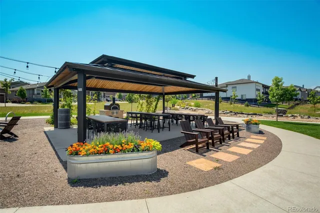 a view of a dining table and chairs in patio