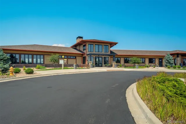 a view of a patio with table and chairs and potted plants