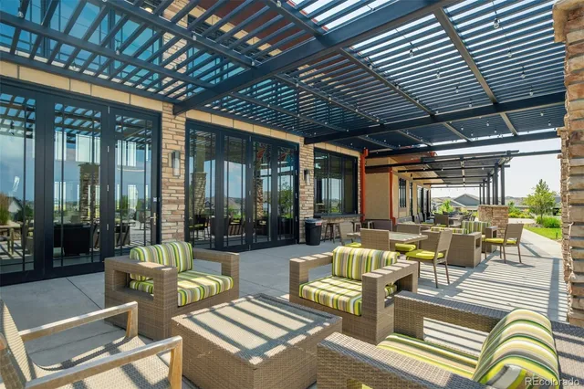 a view of city from balcony with seating area