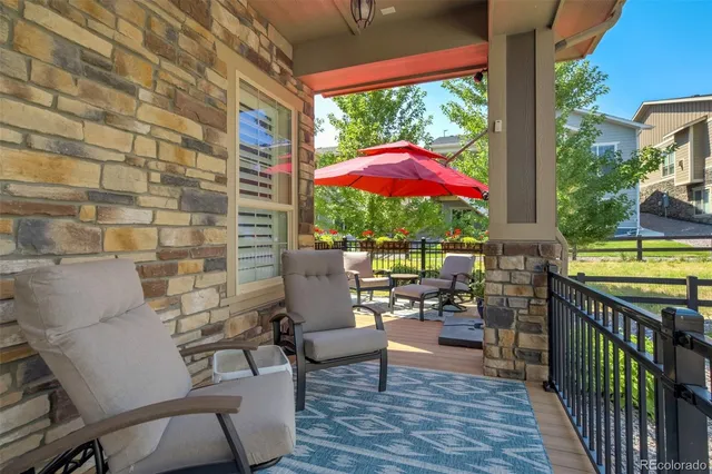 a view of a chairs and table in the balcony
