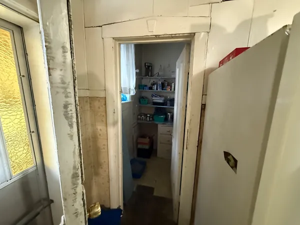 a view of a garage with wooden furniture