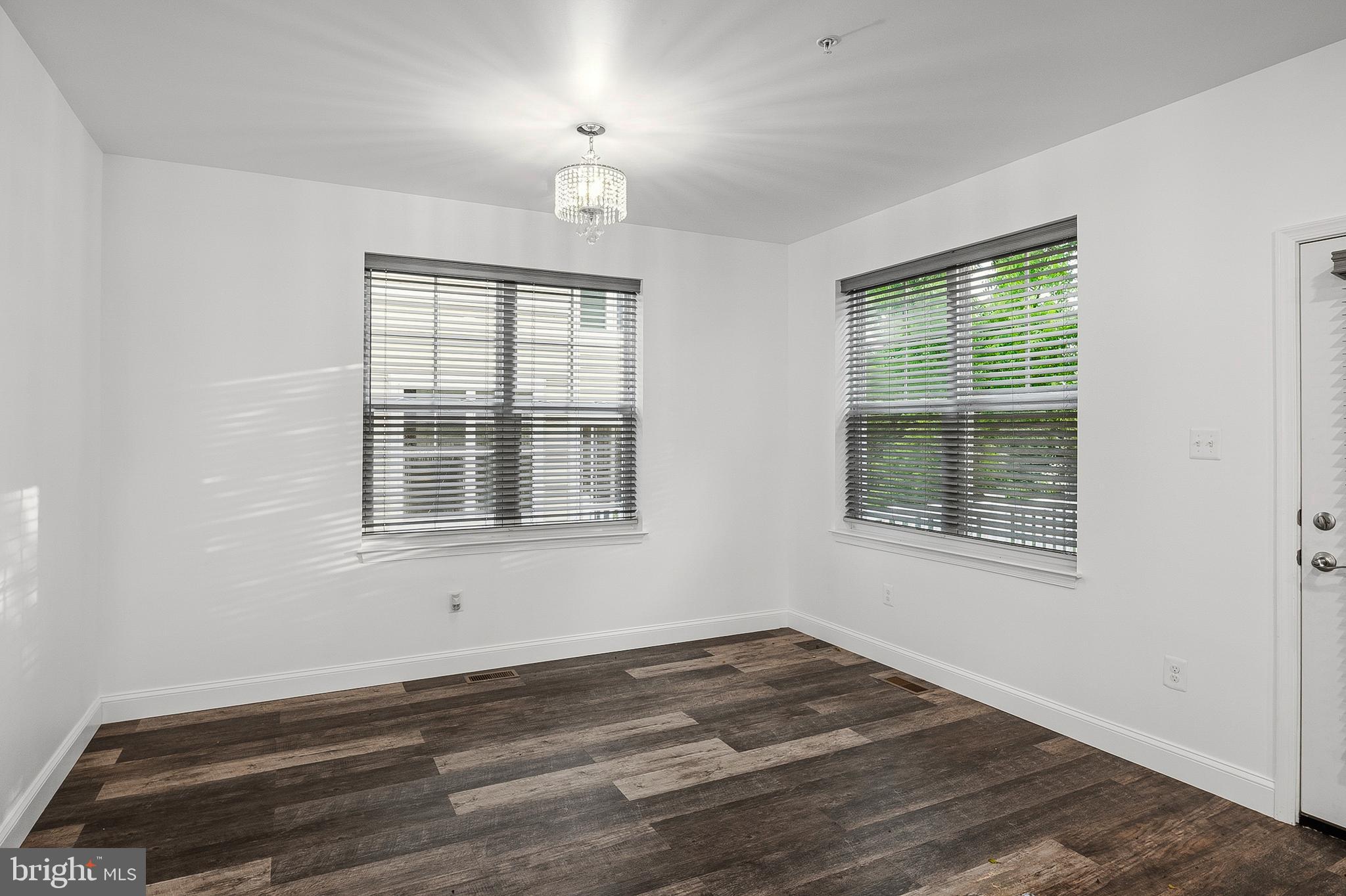 33 Greensborough Road Reisterstown, MD 21136 - Photo 14 of 40 a view of an empty room with wooden floor and a window