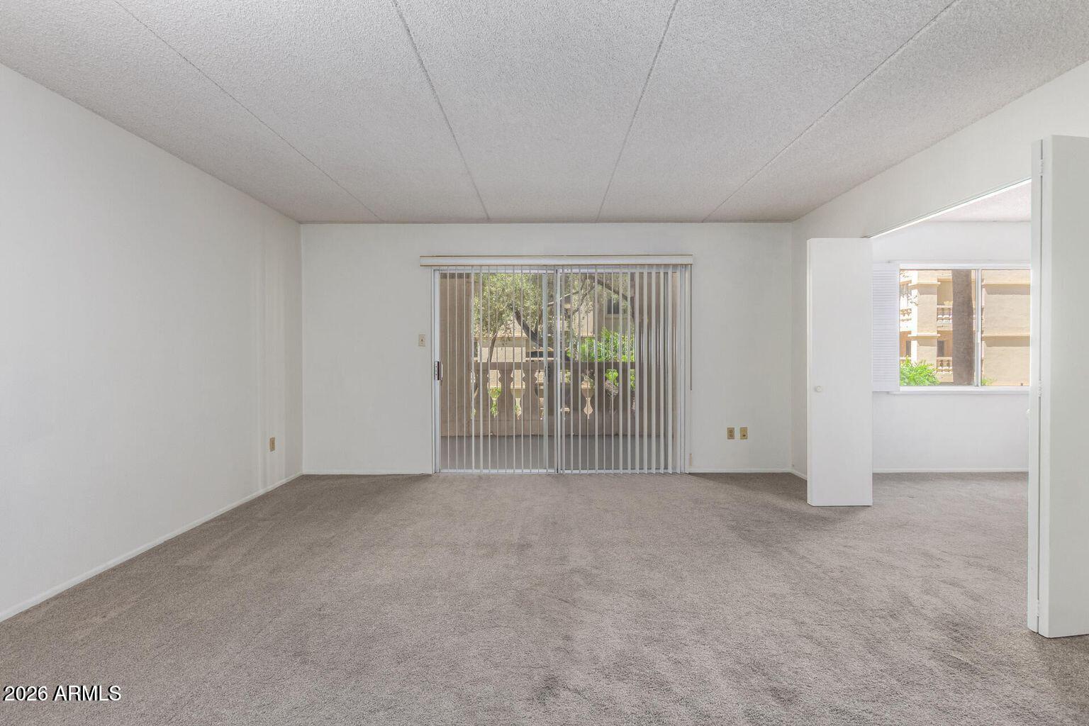 7950 East Camelback Road, Unit 28205 Scottsdale, AZ 85251 - Photo 14 of 23 an empty room with windows