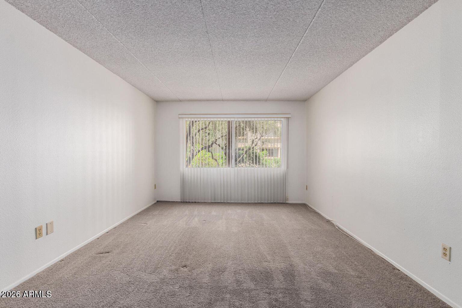 7950 East Camelback Road, Unit 28205 Scottsdale, AZ 85251 - Photo 16 of 23 an empty room with windows
