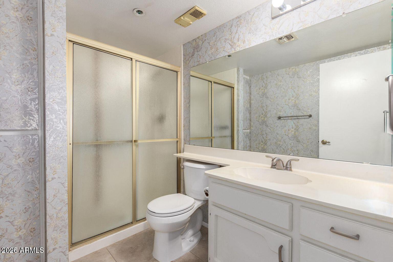 7950 East Camelback Road, Unit 28205 Scottsdale, AZ 85251 - Photo 17 of 23 a bathroom with a sink a toilet and shower