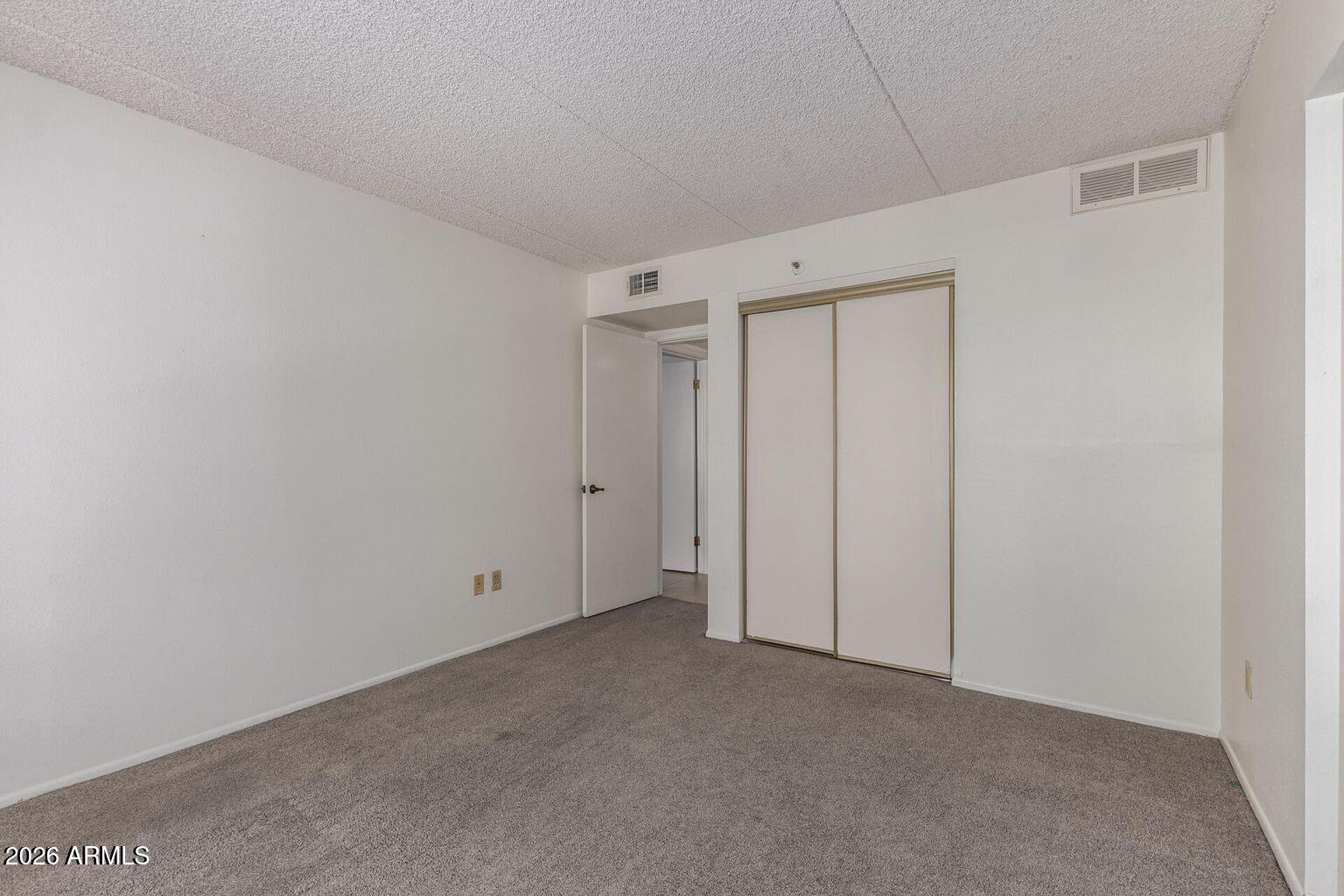 7950 East Camelback Road, Unit 28205 Scottsdale, AZ 85251 - Photo 19 of 23 a view of an empty room