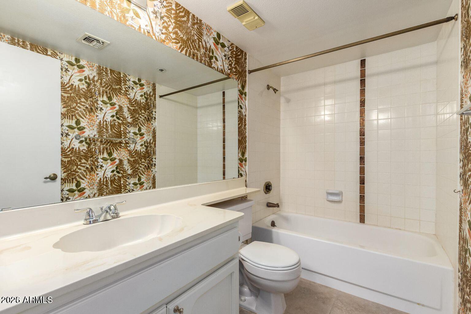 7950 East Camelback Road, Unit 28205 Scottsdale, AZ 85251 - Photo 23 of 23 a bathroom with a sink and a mirror