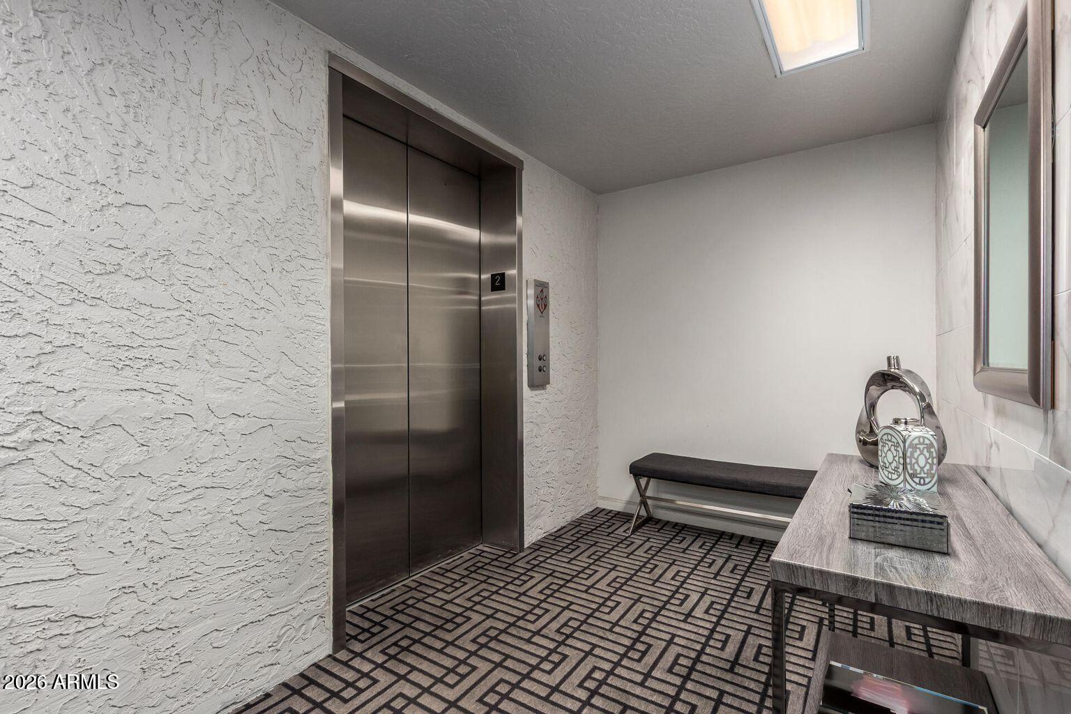 7950 East Camelback Road, Unit 28205 Scottsdale, AZ 85251 - Photo 3 of 23 a bathroom with a sink and a mirror