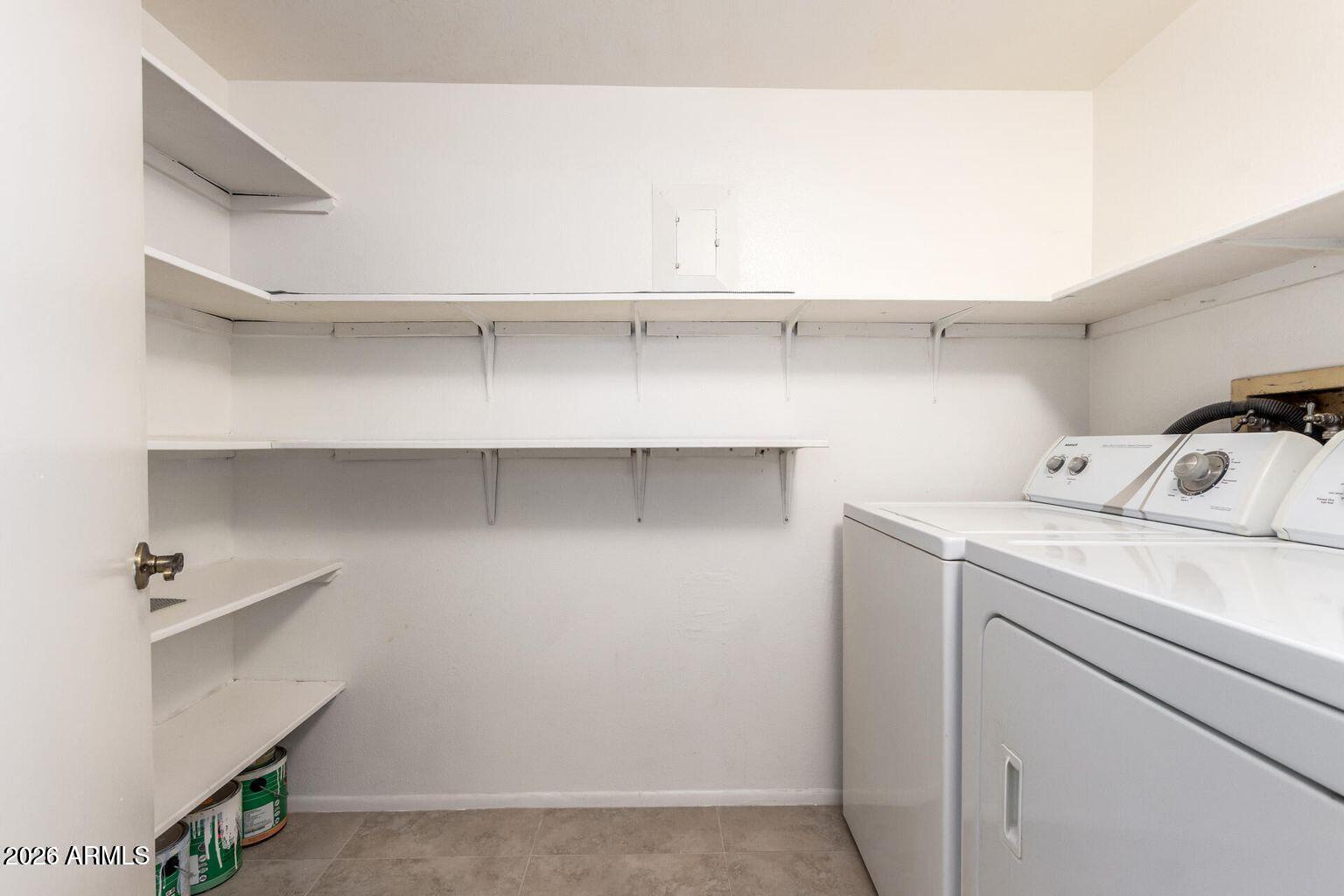 7950 East Camelback Road, Unit 28205 Scottsdale, AZ 85251 - Photo 10 of 23 a utility room with cabinets