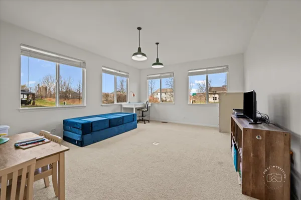 a bedroom with furniture and a window