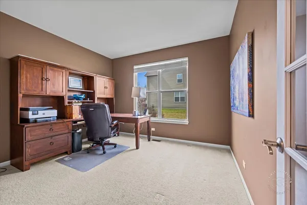 a workspace with furniture and a window