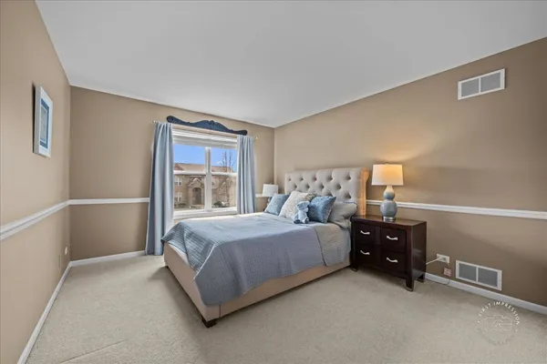 a bed room with a bed and a window