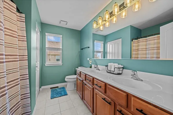 a bathroom with a sink a vanity and a mirror