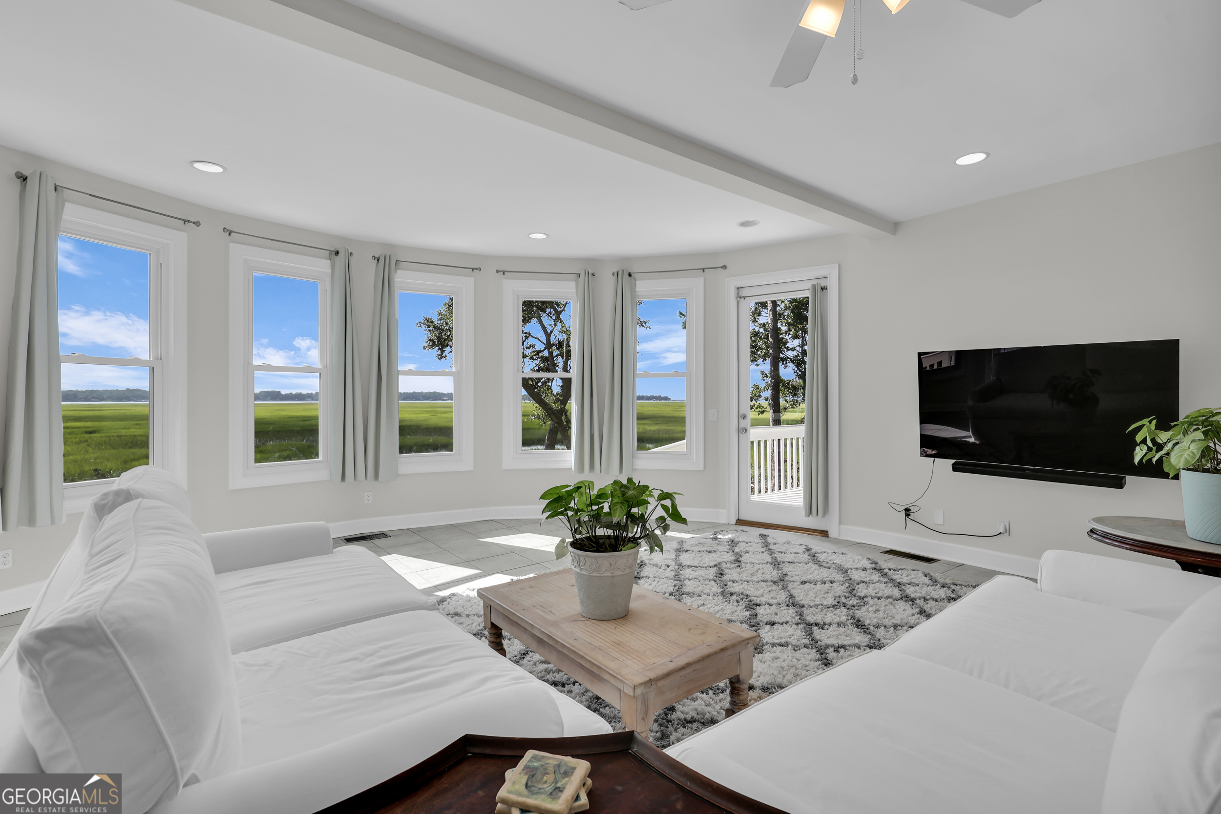 18 Modena Island Drive Savannah, GA 31411 - Photo 11 of 48 a living room with furniture and a flat screen tv