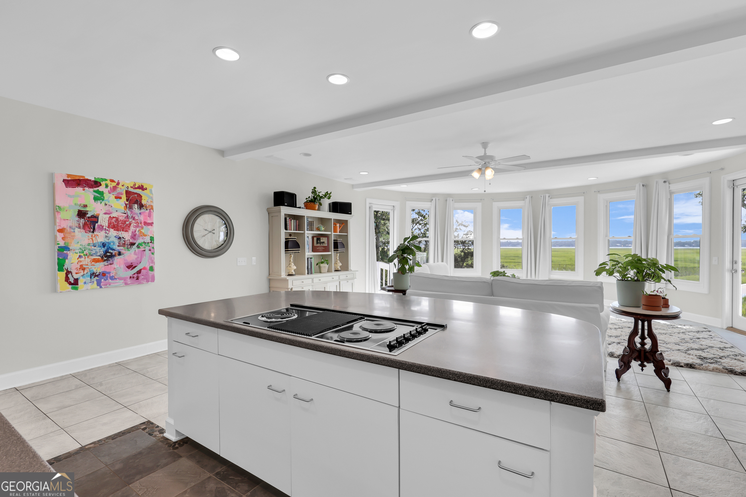 18 Modena Island Drive Savannah, GA 31411 - Photo 15 of 48 a kitchen with stainless steel appliances granite countertop a sink dishwasher with a dining table and chair with wooden floor