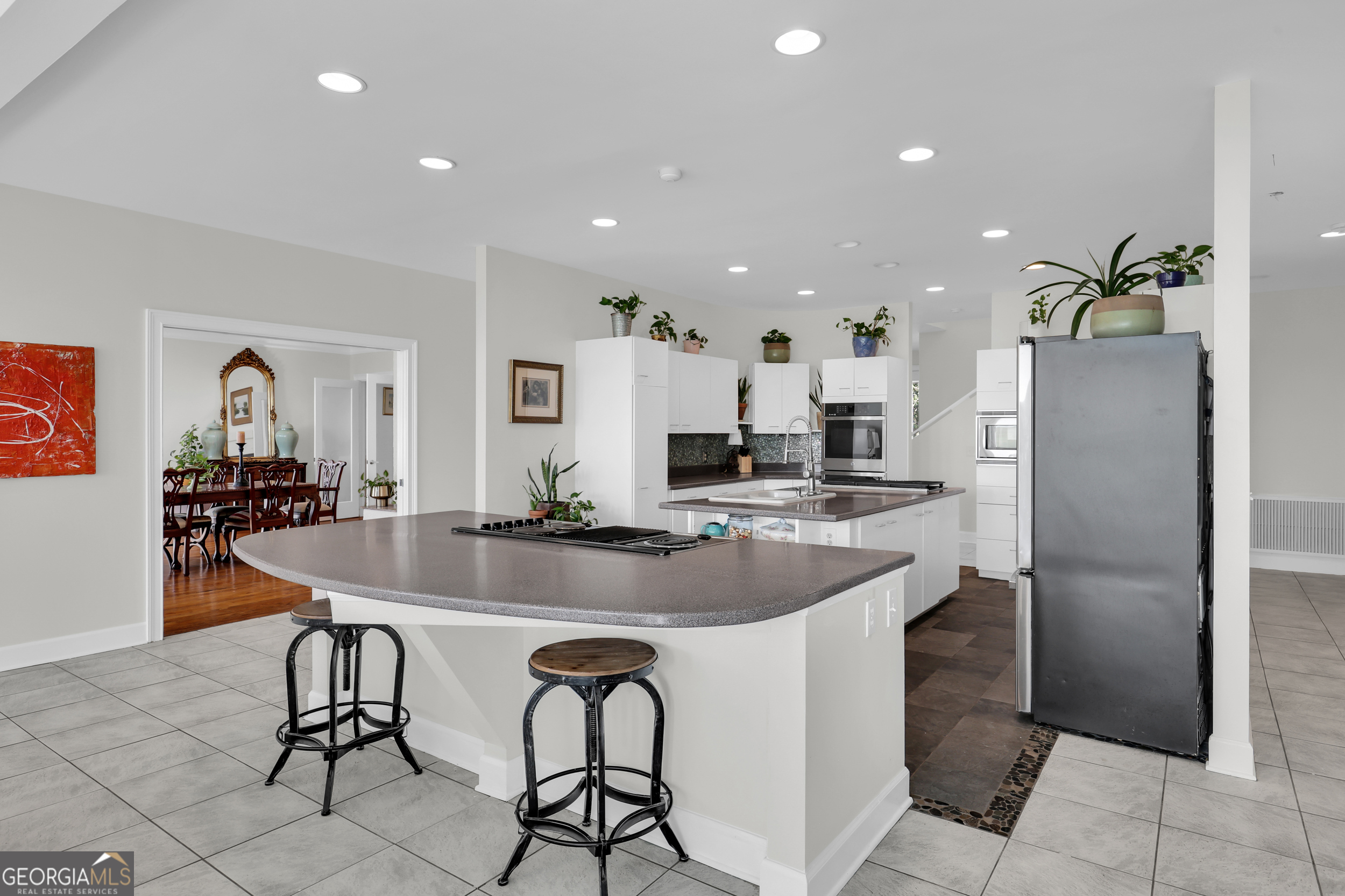 18 Modena Island Drive Savannah, GA 31411 - Photo 17 of 48 a kitchen with refrigerator and chairs