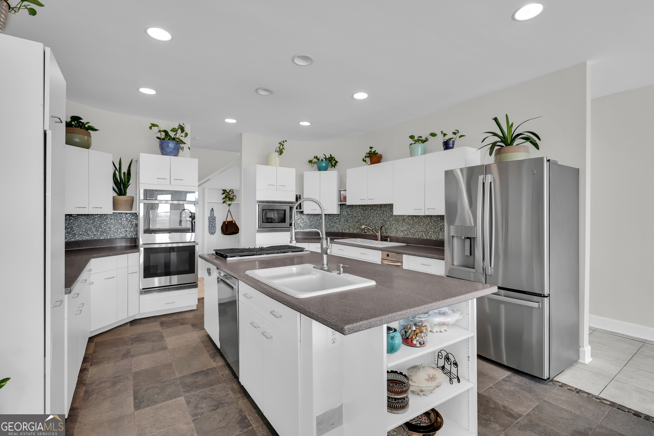 18 Modena Island Drive Savannah, GA 31411 - Photo 18 of 48 a kitchen with stainless steel appliances granite countertop a sink and a refrigerator